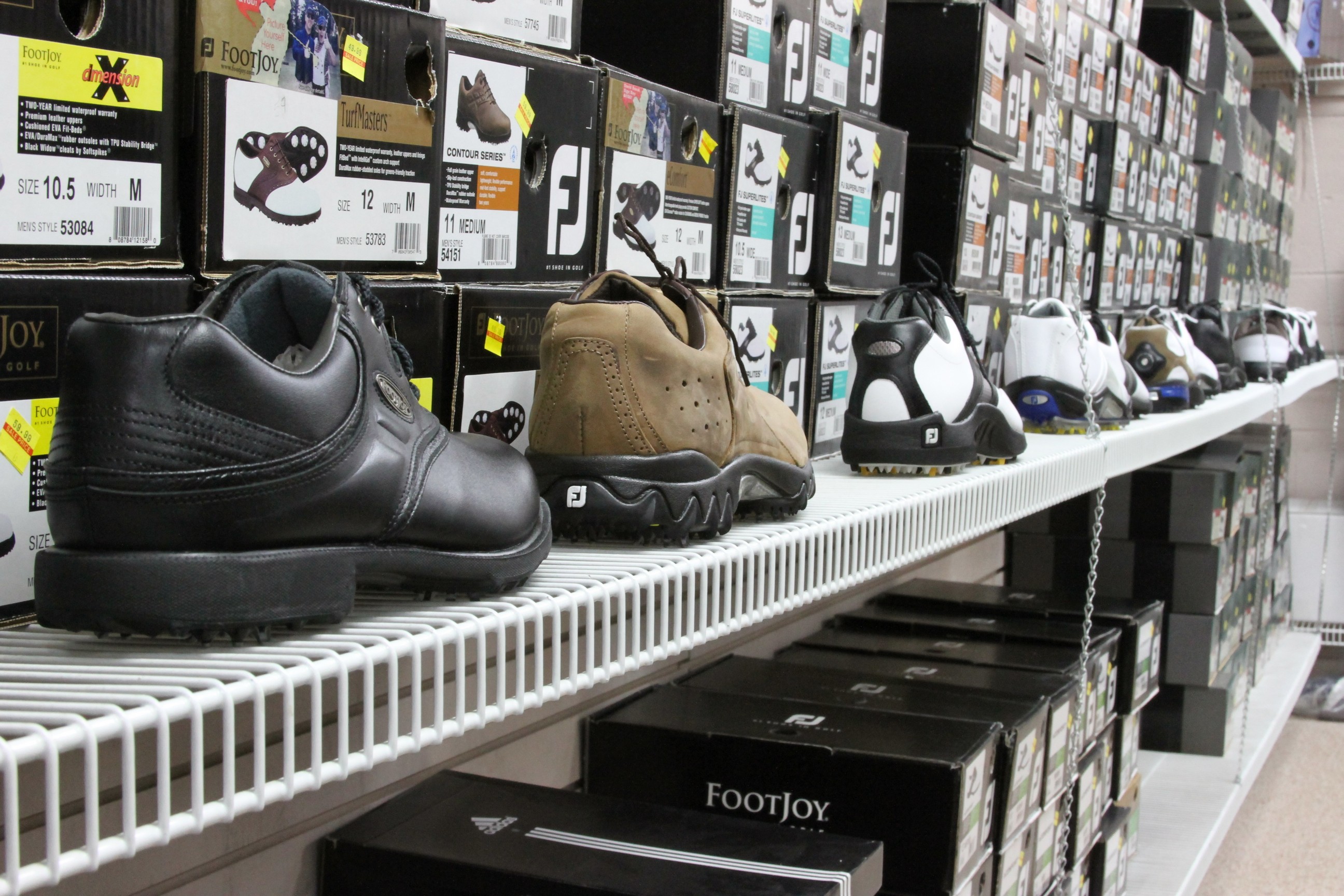 Titleist and FootJoy caps on display at Discount Golf, Royal Oak Michigan golf store