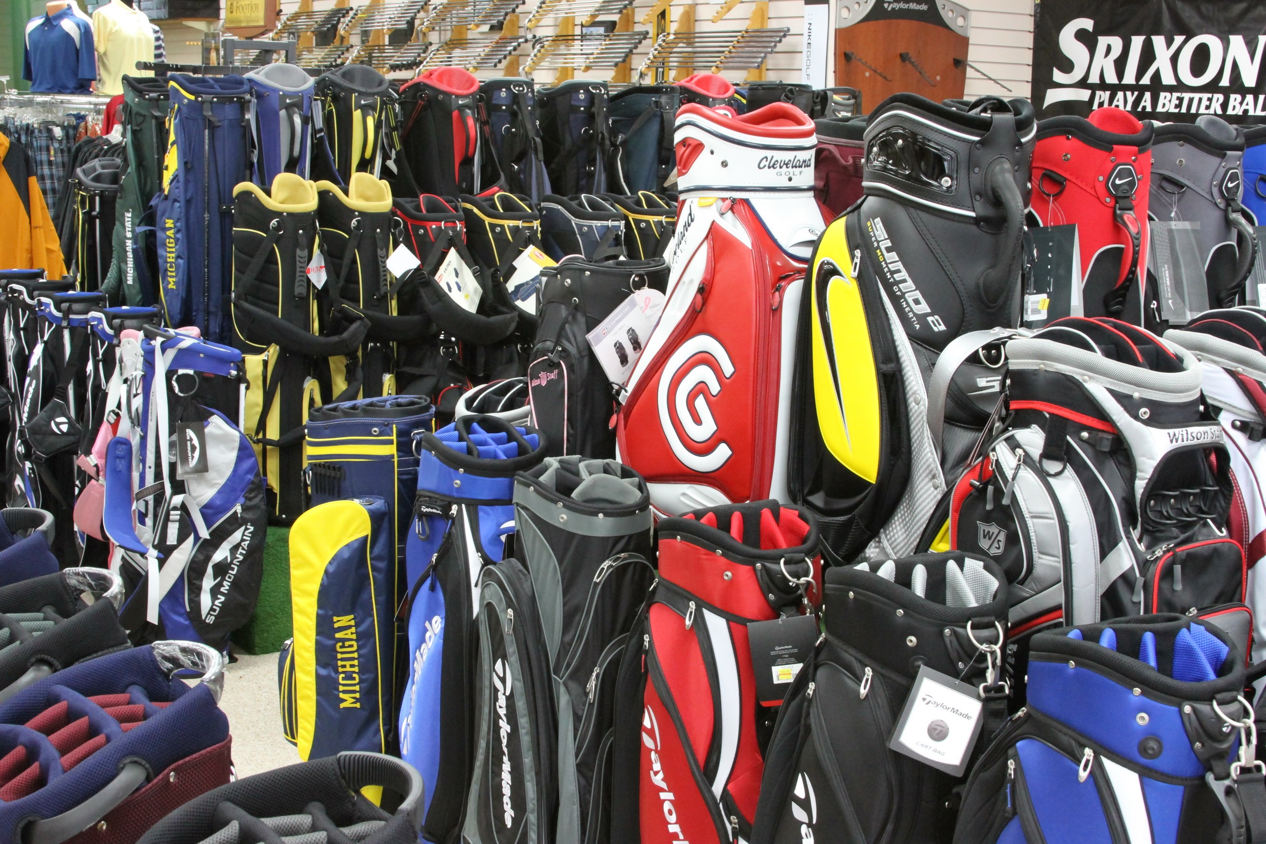 Wall of golf bags for sale at Discount Golf, Royal Oak Michigan's golf store on Woodward Avenue